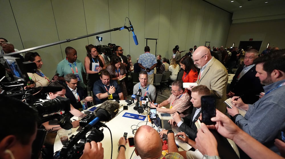 New York Giants head coach John Harbaugh talks with reporters at the annual NFL football meetings, Monday, March 30, 2026, in Phoenix. (AP Photo/Ross D. Franklin)
