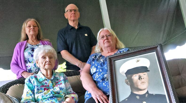 Over 50 years after he was killed in Vietnam, Greenon Graduate Billy Bloomfield is remembered by his family, clockwise from bottom left, his mother Beulah Bloomfield, sister Brenda Hopkins, brother Tom and sisiter Kathy Smith. BILL LACKEY/STAFF