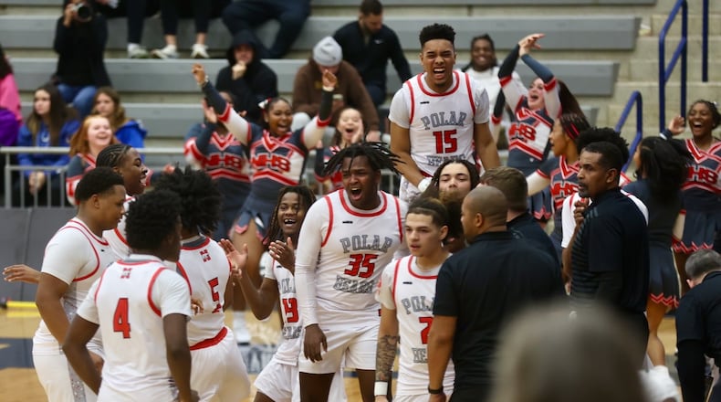 Northridge celebrates a victory against Margaretta at the Beacon Orthopaedics Flyin’ To The Hoop on Monday, Jan. 19, 2026, at Trent Arena in Kettering. David Jablonski/Staff