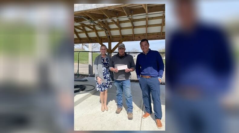 Eddie Bell and Mary Jo Leventhal, of Springfield Rotary, presented a $25,000 check to Terry Fredrich, of Jefferson Street Oasis, in honor of the upcoming 10th anniversary of the Springfield Rotary Gourmet Food Truck Competition. Contributed