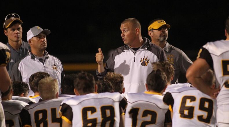Kenton Ridge assistant coach Jon Daniels talks to the team after a loss to Mechanicsburg on Friday, Aug. 30, 2019, at Mechanicsburg. David Jablonski/Staff