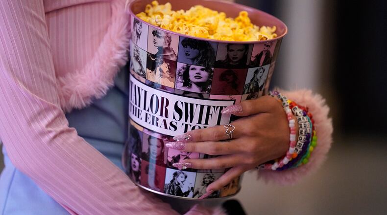 A fan attends the world premiere of the concert film "Taylor Swift: The Eras Tour" on Wednesday, Oct. 11, 2023, at AMC The Grove 14 in Los Angeles. (AP Photo/Chris Pizzello)