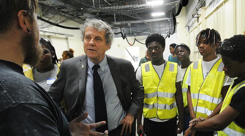 Senator Sherrod Brown talks with instructors and students at the Dayton Buildings Trades Construction Camp Thursday June  29, 2023 held at the IBEW Local 82 Hall. MARSHALL GORBY\STAFF