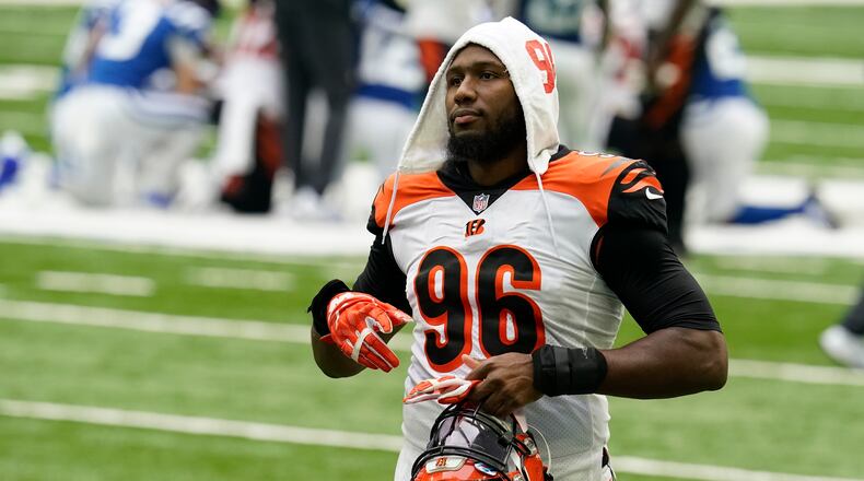Cincinnati Bengals' Carlos Dunlap (96) walks off the field following an NFL football game against the Indianapolis Colts, Sunday, Oct. 18, 2020, in Indianapolis. (AP Photo/Michael Conroy)