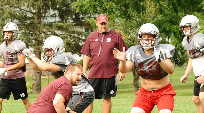 Urbana football coach Carleton Cotner (center) watches his team run through preseason drills. Cotner returns for a second season in 2018 after guiding the Hillclimbers to a 4-6 record overall and 3-1 in the Mad River Division of the Central Buckeye Conference. GREG BILLING / CONTRIBUTED