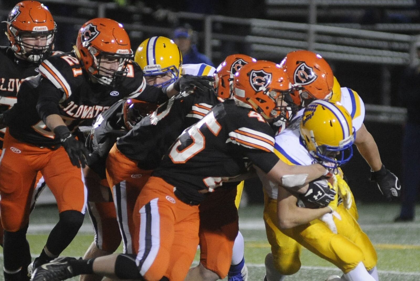 The Coldwater defense joins forces to stop Marion Local’s Matt Rethman. Marion Local defeated Coldwater 33-0 in a D-VI, Region 24 high school football playoffs regional final at Sidney on Friday, Nov. 17, 2017. MARC PENDLETON / STAFF