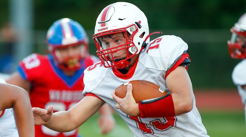 Southeastern High School sophomore running back Hayden Davis carries the ball during their game at Northwestern earlier this season. The Trojans are 3-0 for the first time since 2009. Michael Cooper/CONTRIBUTED