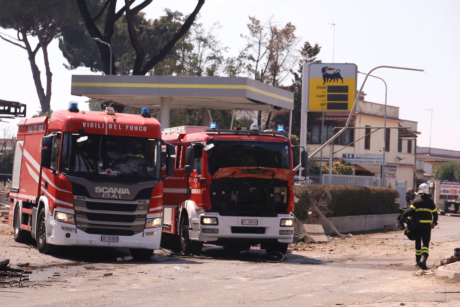 Firefighters work on a cite of a gas station explosion on the outskirts of Rome, Friday, July 4, 2025. (Cecilia Fabiano/LaPresse via AP)