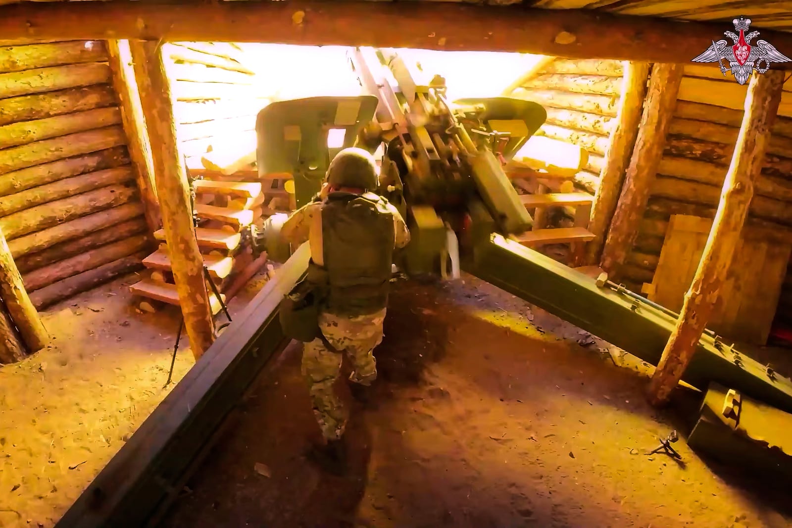 In this photo taken from video distributed by Russian Defense Ministry Press Service on Wednesday, July 16, 2025, a Russian soldier fires a 152 mm howitzer 2A65 Msta-B towards Ukrainian position in an undisclosed location in Ukraine. (Russian Defense Ministry Press Service via AP)