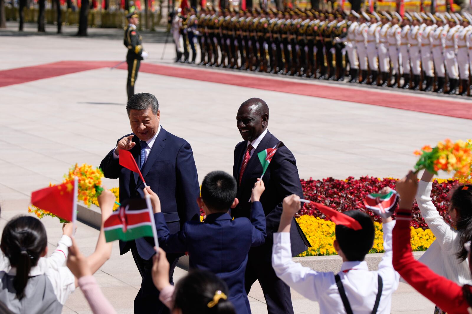 Chinese President Xi Jinping, center left, and Kenyan President William Ruto attend a welcome ceremony at the Great Hall of the People in Beijing Thursday, April 24, 2025. (Iori Sagisawa/Pool Photo via AP)