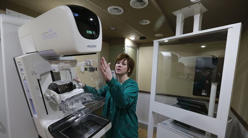 Selena Kemper, supervisor of the Mammography Department Community Mercy Health Partners, talks about the 3D mammography machine in the new Mobile Mammography Unit earlier this year. BILL LACKEY/STAFF