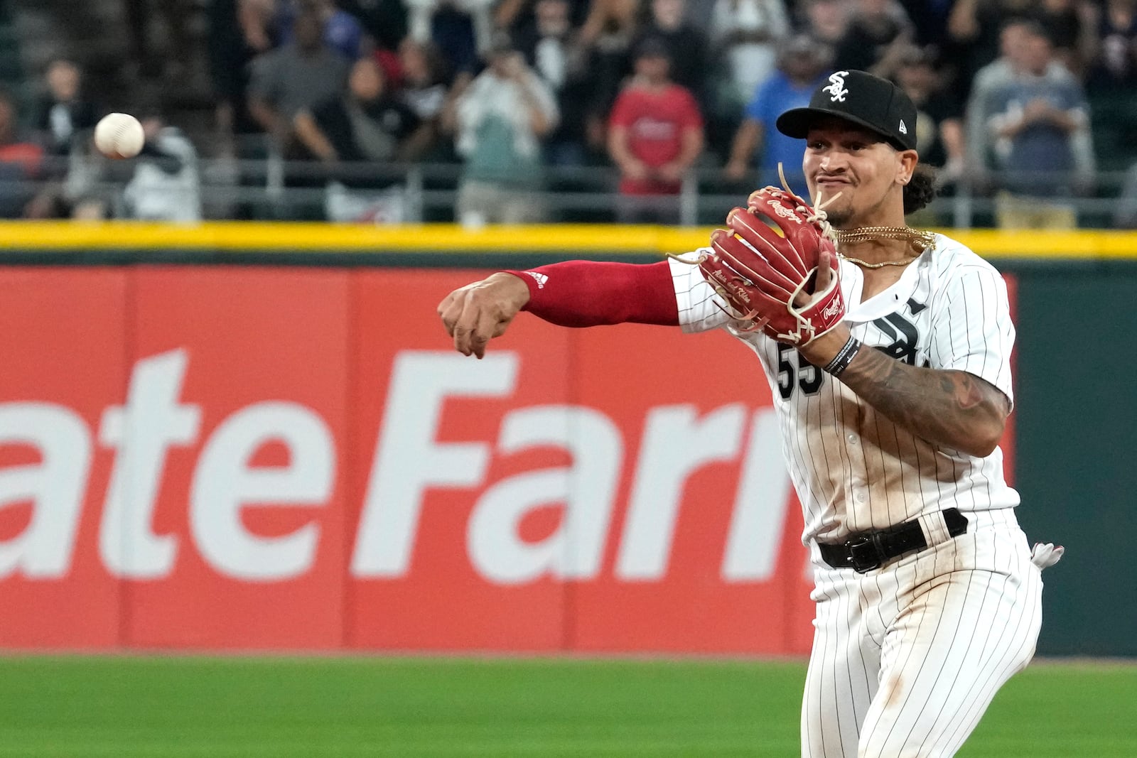 FILE - Chicago White Sox second baseman Jose Rodriguez throws out Texas Rangers' Jonah Heim at first base during the ninth inning of a baseball game in Chicago, Tuesday, June 20, 2023. (AP Photo/Nam Y. Huh, File)