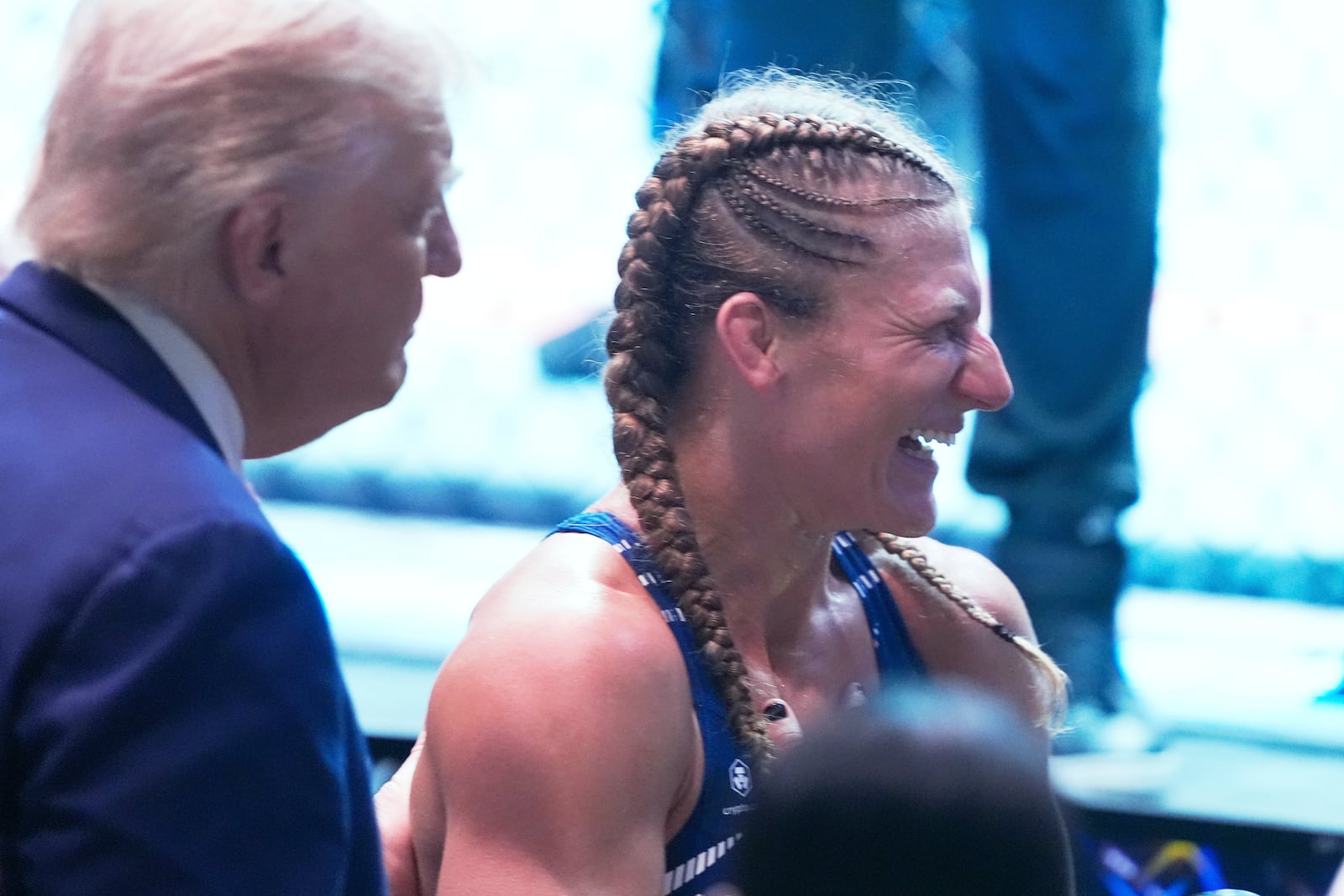 President Donald Trump congratulates Kayla Harrison after winning her women's bantamweight bout against Julianna Pena during the UFC-316 mixed martial arts event, at the Prudential Center, Saturday, June 7, 2025, in Newark, N.J. (AP Photo/Manuel Ceneta)
