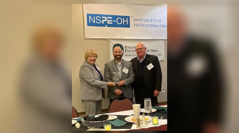 Sweet Manufacturing Company in Springfield has been awarded the Ohio New Product Award. Vice President of Engineering Chris Smith (middle) received the award on behalf of the company. From left to right are Tina Sutermeister, representing NSPE-Ohio’s Professional Engineers in Industry practice division; Smith; and NSPE-Ohio President Dennis Irwin. Contributed