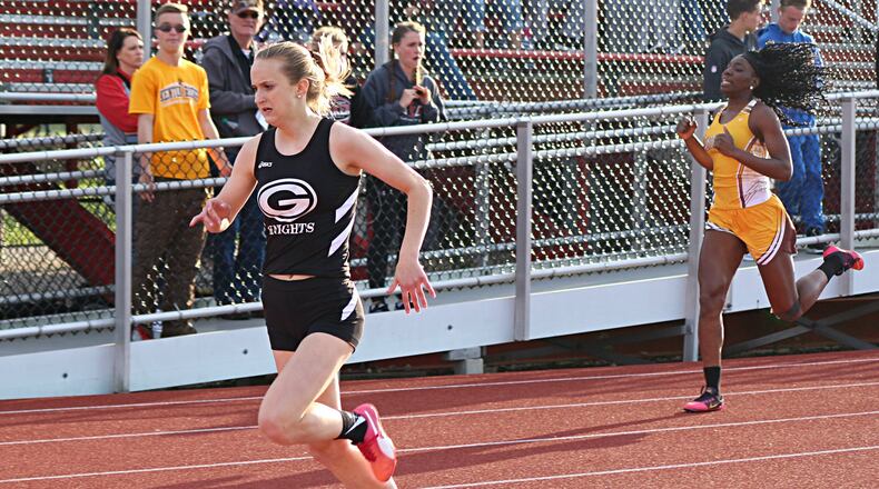 Greenon High School freshman Delaney Benedict won the 400-meter dash in 57.93 seconds Friday to hold off two-time defending champ Jamari McDavid of Kenton Ridge. GREG BILLING / CONTRIBUTED