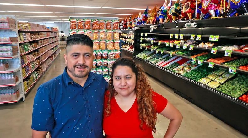 Alicia Marcado and her husband, Saul, in their new store, Adasa Latin Market, at 1883 South Limestone Street Friday, July 14, 2023. BILL LACKEY/STAFF