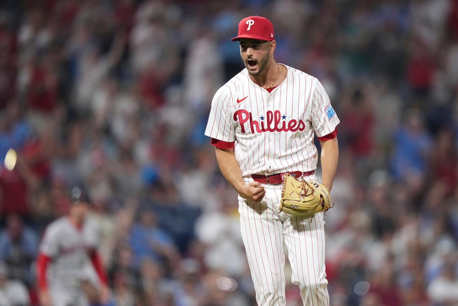 Philadelphia Phillies pitcher Max Lazar reacts after striking out Boston Red Sox's Roman Anthony during the 10th inning of a baseball game Monday, July 21, 2025, in Philadelphia. (AP Photo/Matt Slocum)