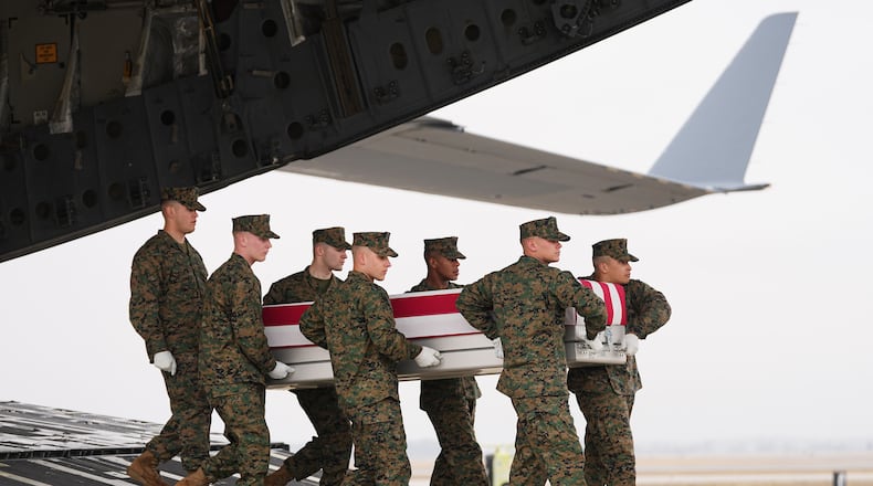 A Marine Corps carry team moves the transfer case containing the remains of U.S. Marine Corps Lance Cpl. Kevin Melendez of Fort Worth, Texas, Wednesday March 4, 2026, at Dover Air Force Base, Del. (AP Photo/Matt Rourke)