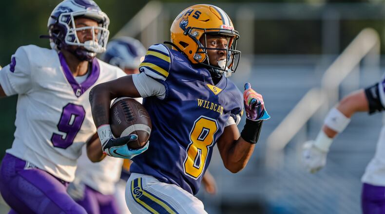 Springfield High School junior Sherrod Lay, Jr. runs the ball during their game against Gonzaga College High School on Friday night at Springfield High School. The Wildcats fell 14-6. Michael Cooper/CONTRIBUTED