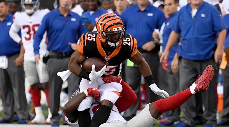 CINCINNATI, OH - AUGUST 22: Giovani Bernard #25 of the Cincinnati Bengals is tackled after catching a pass during the first quarter of the preseason game against the New York Giants at Paul Brown Stadium on August 22, 2019 in Cincinnati, Ohio. (Photo by Bobby Ellis/Getty Images)