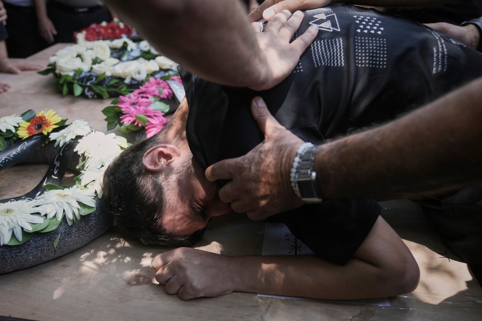 Relatives attend the funeral of four members of the Khatib family, Palestinian citizens of Israel killed in an Iranian missile strike on Tamra, Israel, on Tuesday, June 17, 2025. (AP Photo/Mahmoud Illean)