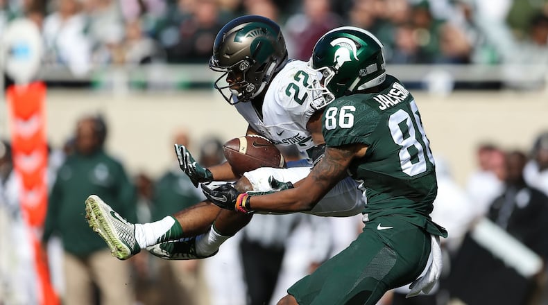 Fairfield High School graduate Josiah Scott (22) comes up with an interception during Michigan State’s spring football game April 1 in East Lansing, Mich. PHOTO COURTESY OF MICHIGAN STATE ATHLETICS