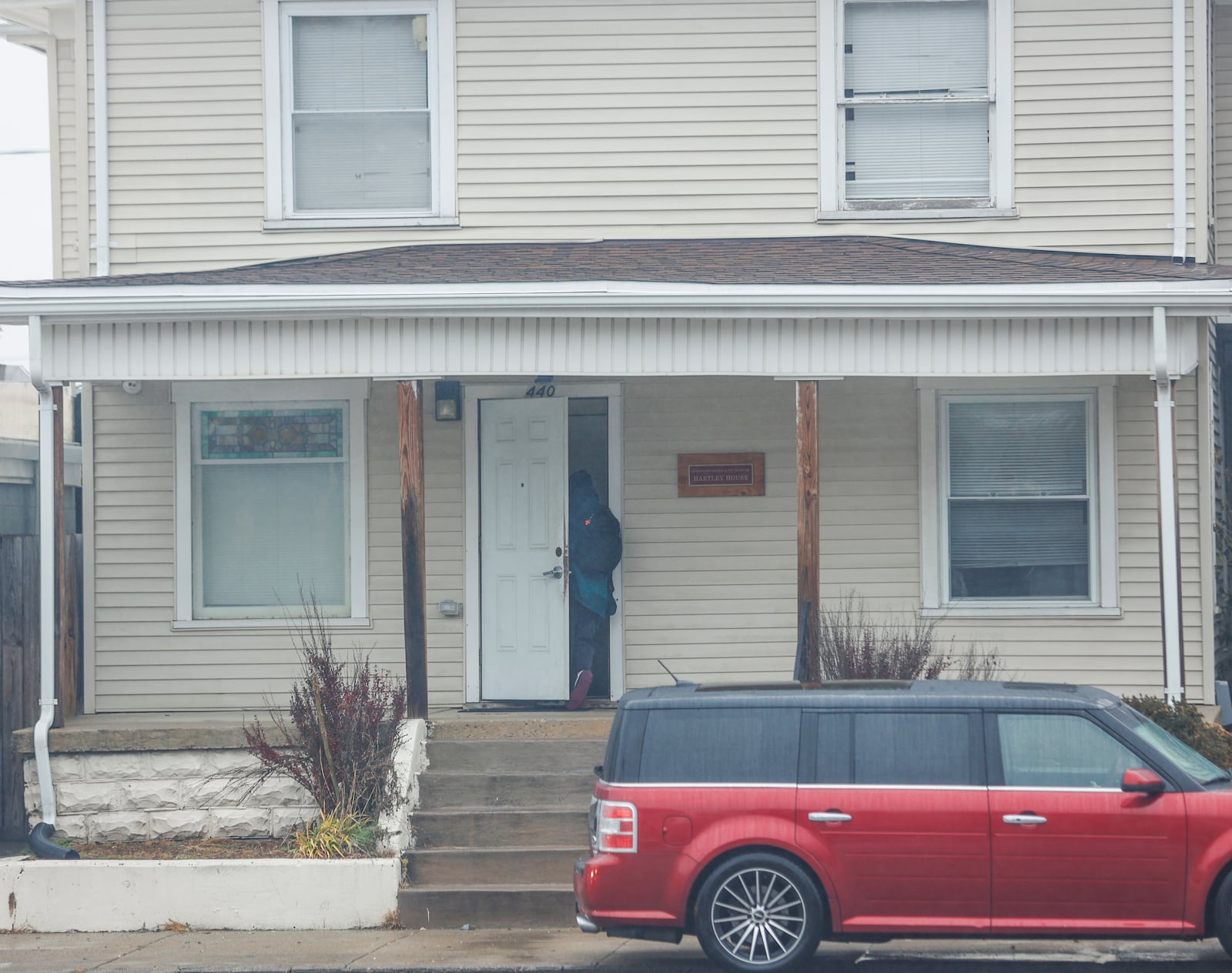 A man walks into the Hartley House on Monday, November 24, 2025, in Springfield. The men's shelter will close in January due to a lack of funding. JOSEPH COOKE/STAFF