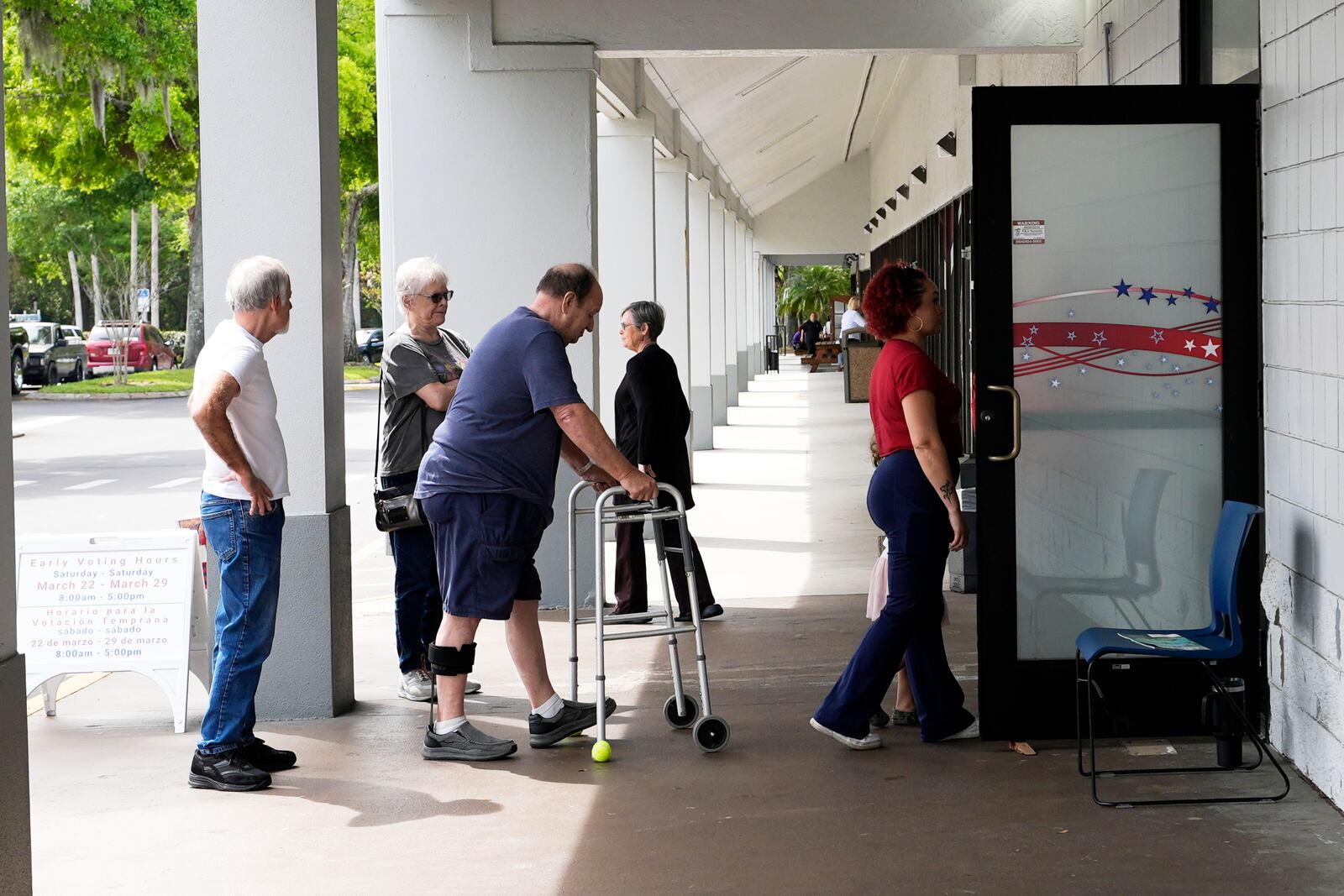 Early voters line up outside the Supervisor of Elections office Tuesday, March 25, 2025, in DeLand, Fla. (AP Photo/John Raoux)
