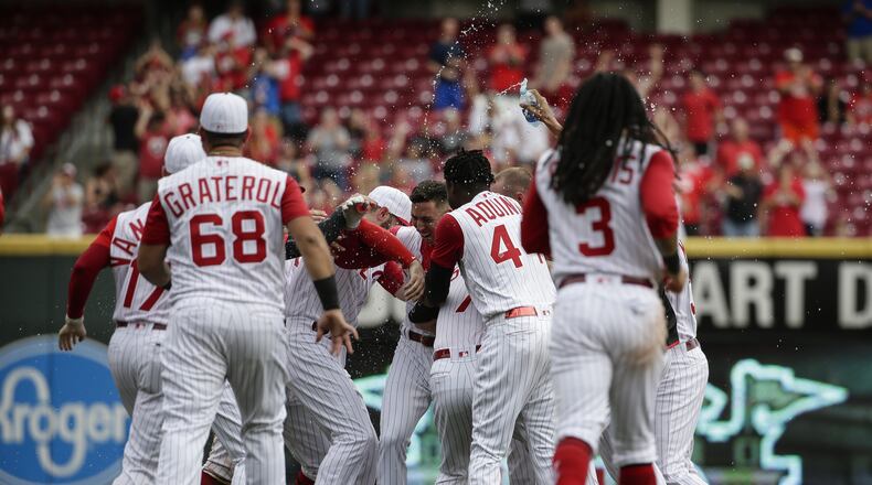 CINCINNATI, OHIO - SEPTEMBER 08: Michael Lorenzen #21 of the Cincinnati Reds celebrates hitting the game winning double against the Arizona Diamondbacks during the ninth inning at Great American Ball Park on September 08, 2019 in Cincinnati, Ohio. (Photo by Silas Walker/Getty Images)