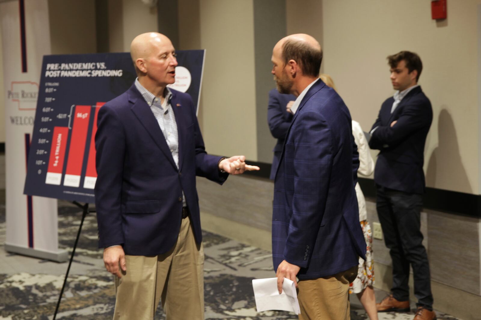 U.S. Sen. Pete Ricketts talks with Kearney, Neb., Mayor Jonathan Nikkila before holding a town hall meeting Thursday, April 24, 2025, in the central Nebraska community. (AP Photo/Josh Funk)