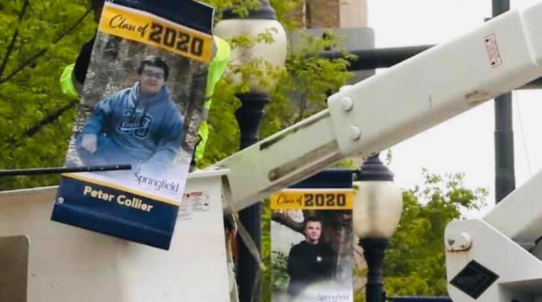 Springfield High School is showcasing nearly 130 graduates on downtown light poles. BILL LACKY/STAFF