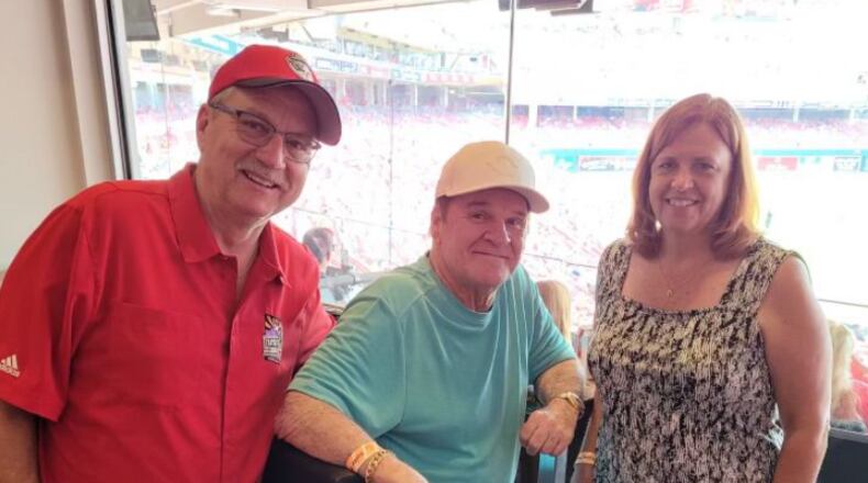 Rick McCrabb and his wife, Tammy, spent time with Cincinnati Reds legend Pete Rose during a 2021 game at Great American Ball Park. SUBMITTED PHOTO