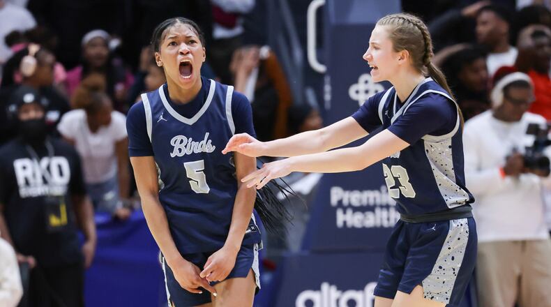 Fairont senior guard Kaylah Thorton (left) celebrates with junior guard Peyton Adams after hitting a tying 3-pointer to send the Division I state final to overtime on Saturday at University of Dayton Arena. The Firebirds won 61-55 to capture their first state title since 2013. BRYANT BILLING / STAFF