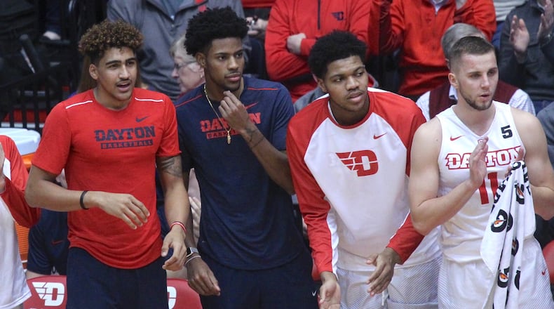Dayton players (left to right) Obadiah Toppin, Xeyrius Williams, Jordan Pierce and Matej Svoboda cheer from the bench during a game against Tennessee Tech on Wednesday, Dec. 6, 2017, at UD Arena. David Jablonski/Staff
