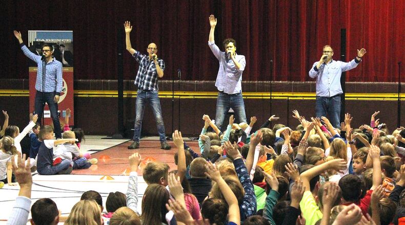 Members of Cadence perform for students at South Vienna School. JEFF GUERINI/STAFF