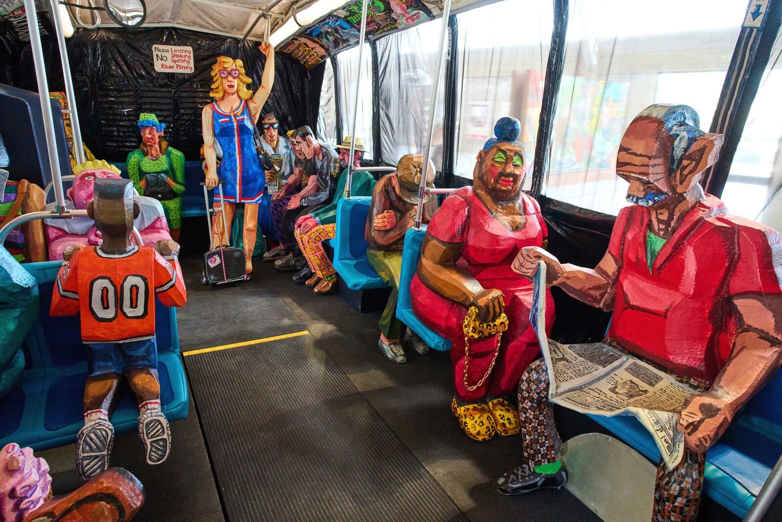 Interior view of The Bus by Red Grooms during a press preview at the Fenix Migration Museum in Rotterdam, Netherlands, Wednesday, May 14, 2025. (AP Photo/Peter Dejong)