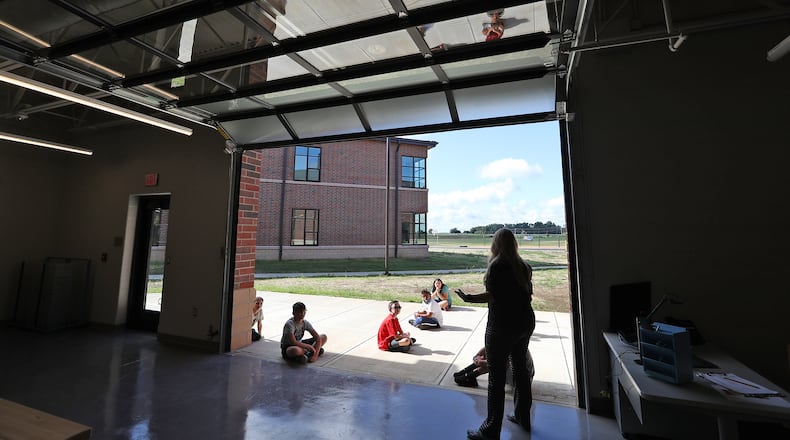 Clark-Shawnee schools has extended its masking requirement through Oct. 1. Here, students and teachers got to know each other in August on the first day of school at Shawnee Elementary. BILL LACKEY/STAFF
