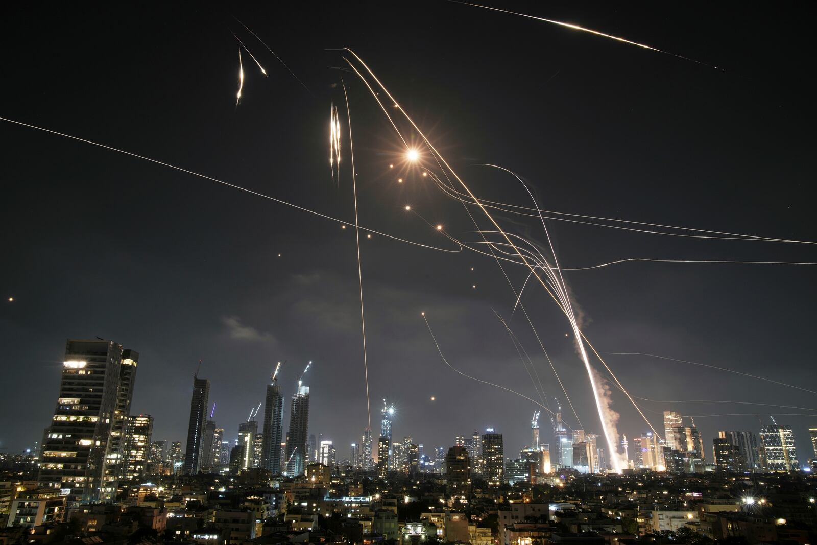 FILE - Israeli Iron Dome air defense system fires to intercept missiles over Tel Aviv, Israel, on June 13, 2025. (AP Photo/Leo Correa, File)