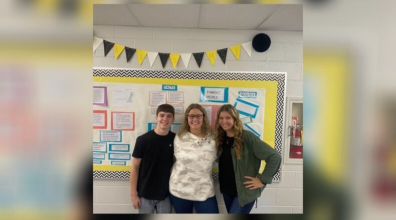 Gavin Wicks (Carah's friend), Carah Brown and Christa Brown (Carah's twin sister). Gavin and Christa helped Carah hang posters around the middle school, create a bulletin board, and organize the week. Contributed/Clark-Shawnee Local Schools