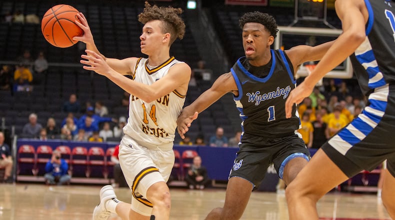 Kenton Ridge's Xavier White pass to the corner in the first half of Division II district final at UD Arena against Cincinnati Wyoming in February of 2024. Jeff Gilbert/CONTRIBUTED
