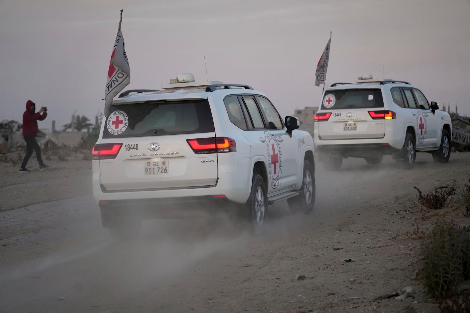 Red Cross vehicles carrying American-Israeli hostage and soldier Edan Alexander leave the Gaza Strip after he was handed over to the organization, Monday, May 12, 2025. (AP Photo/Abdel Kareem Hana)