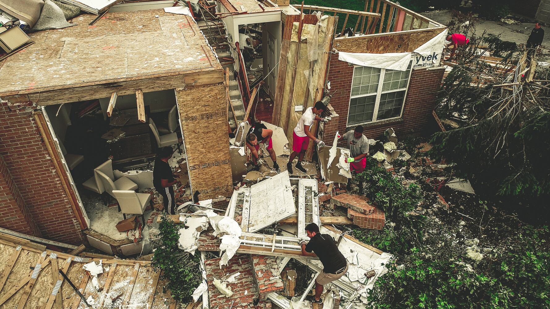 Gallery: Cincinnati Bearcats help clean up after Dayton tornado