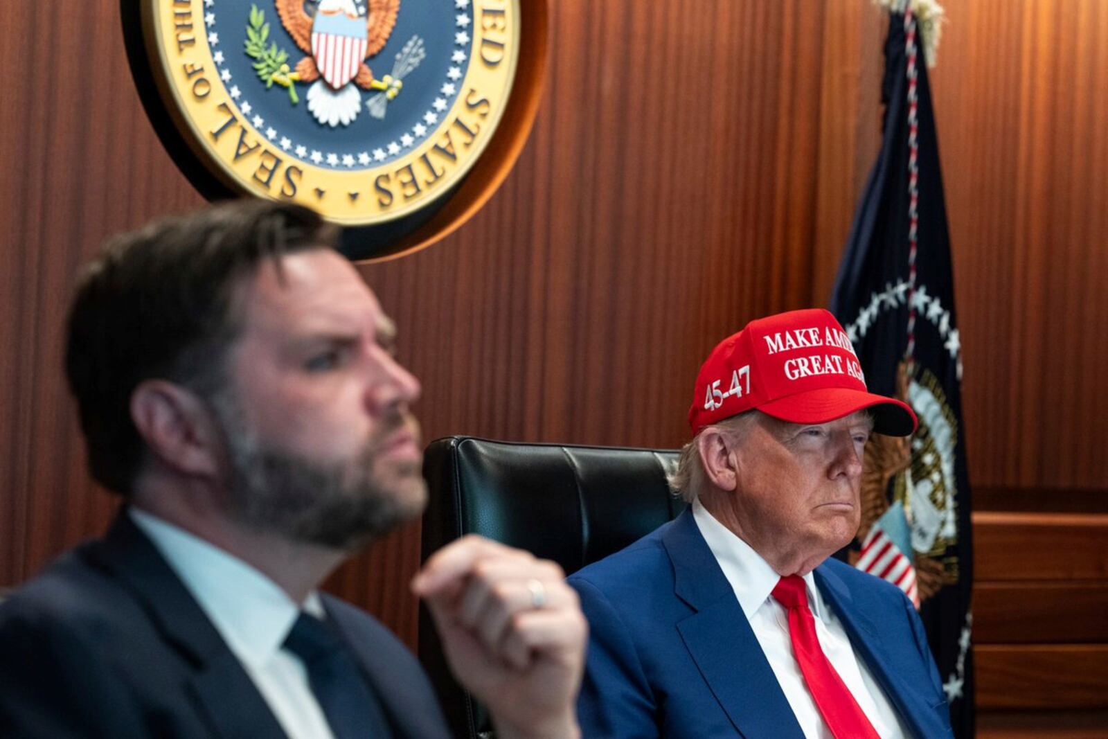 In this image provided by the White House, President Donald Trump, right, and Vice President JD Vance sit in the Situation Room, Saturday, June 21, 2025, at the White House in Washington. (The White House via AP)