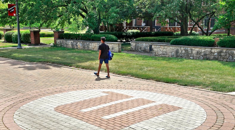 A man walks across the campus of Wittenberg University Thursday, August 1, 2024. BILL LACKEY/STAFF