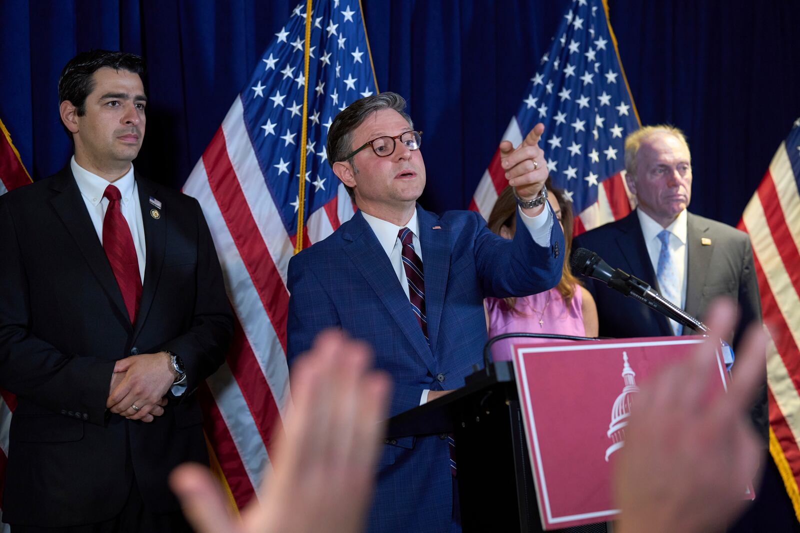 Speaker of the House Mike Johnson, R-La., center, flanked by Rep. Gabe Evans, R-Colo., left, and House Majority Leader Steve Scalise, R-La., defends Donald Trump's handling of protests in Los Angeles and echoed the president's attacks on Democratic Gov. Gavin Newsom as Trump sends thousands of National Guard troops and 700 active duty Marines to quell the protests over raids by Immigration and Customs Enforcement, during a news conference at the RNC near the Capitol in Washington, Tuesday, June 10, 2025. (AP Photo/J. Scott Applewhite)