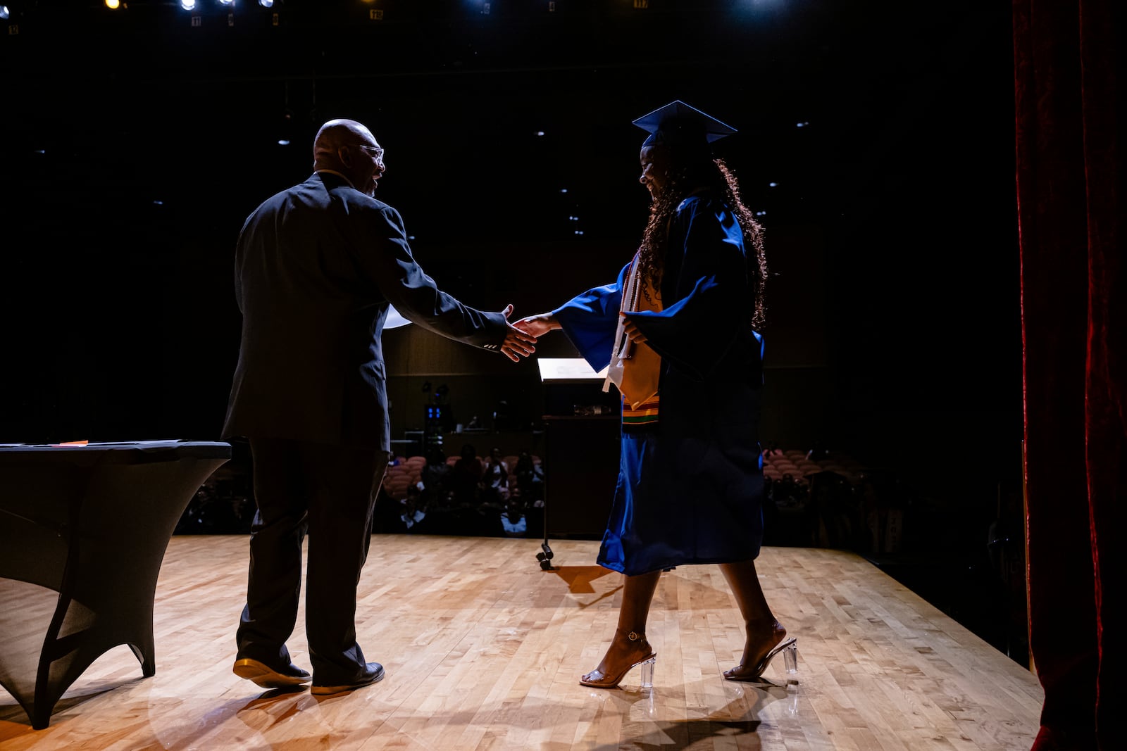 A student receives their certificate of achievement during the Senior Salute at Lyric Theatre in Lexington, Ky., Wednesday, May 7, 2025. (AP Photo/Jon Cherry)