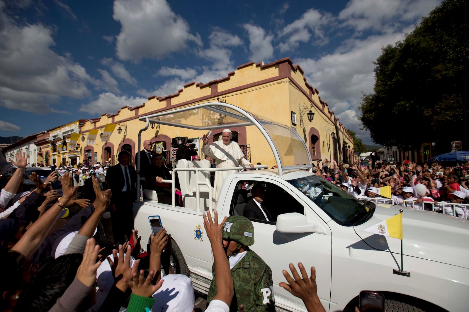 FILE - Pope Francis waves from his popemobile as he leaves the Cathedral in San Cristobal de las Casas, Mexico, Feb. 15, 2016. (AP Photo/Eduardo Verdugo, File)