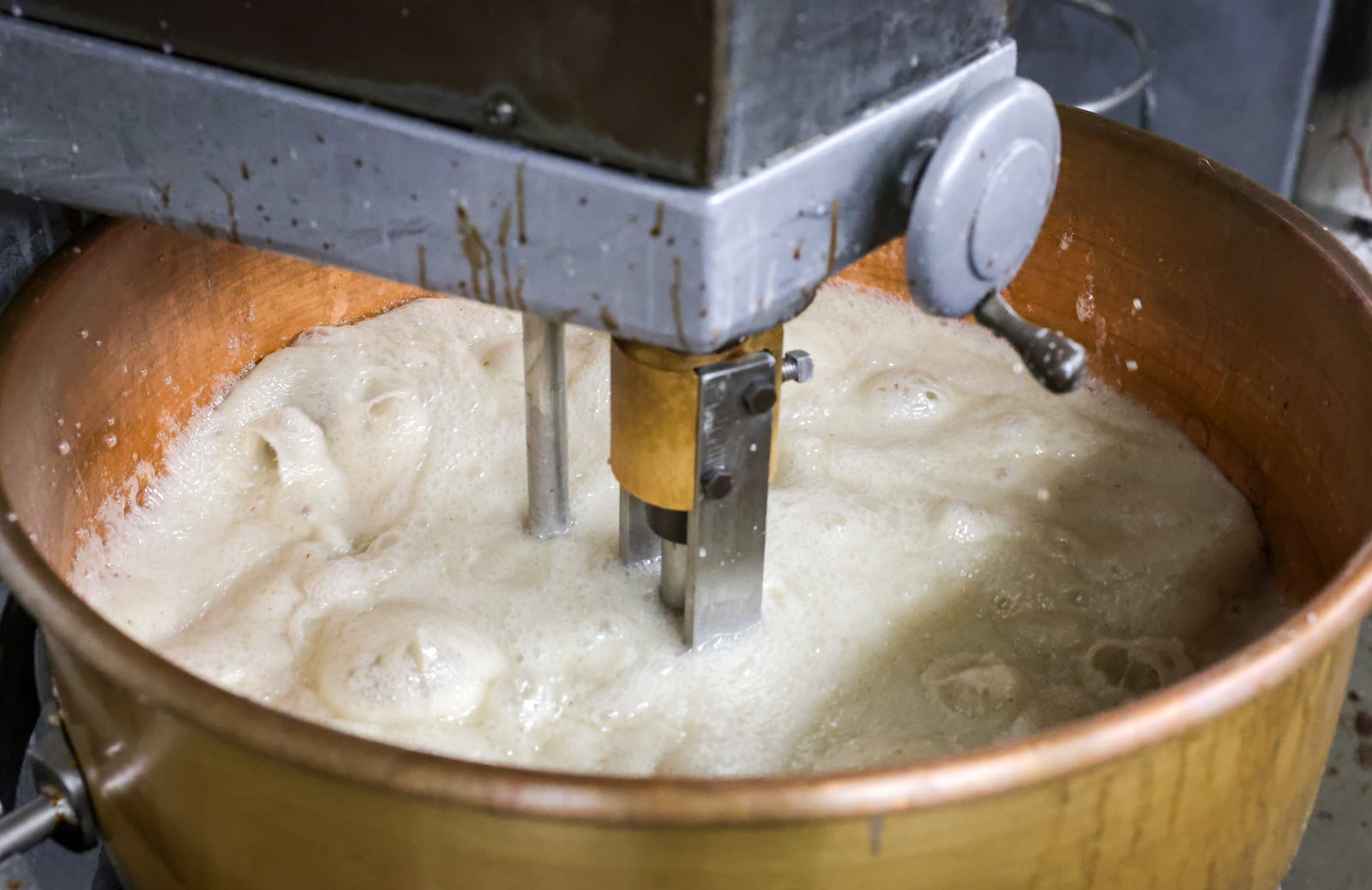 Much of the company's equipment used at its manufacturing plant on Wayne Avenue is from the mid-20th century, including heavy cream mixing kettle pots from the 1960s. BRYANT BILLING / STAFF