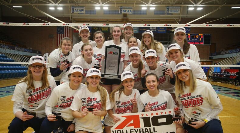 The Dayton volleyball team poses for a photo after winning the Atlantic 10 championship in 2019. Photo courtesy of UD and A-10