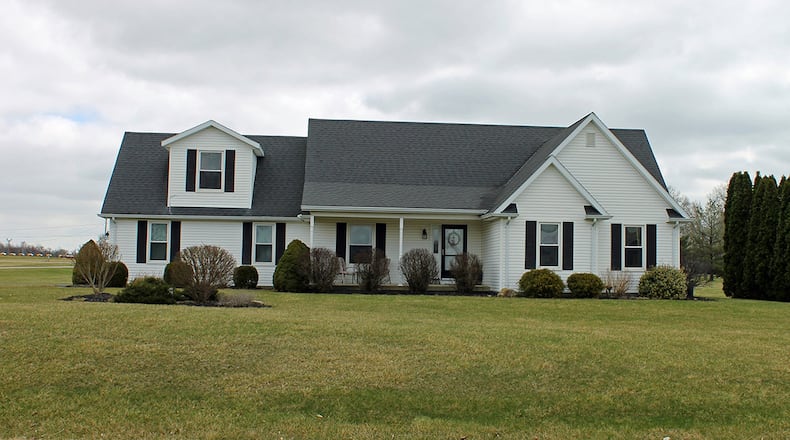 The 4-bedroom home offers about 2,070 sq. ft. of living space with an open concept floor plan. A great room provides space for entertaining. CONTRIBUTED PHOTO BY VICKIE KAPNAS